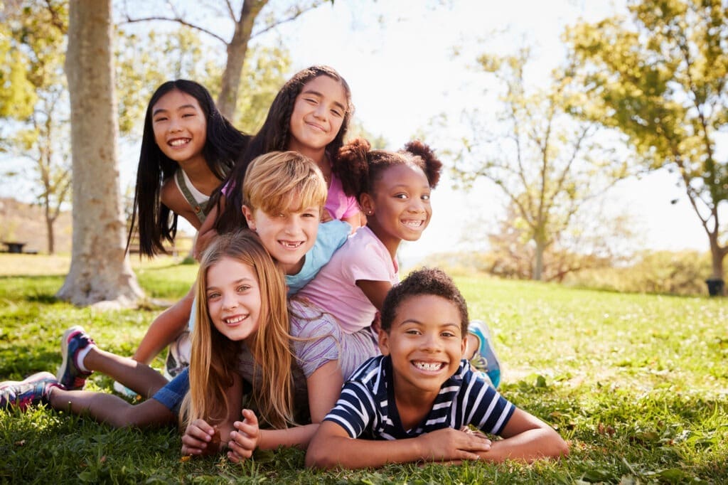 Children engaged in creative play therapy at park
